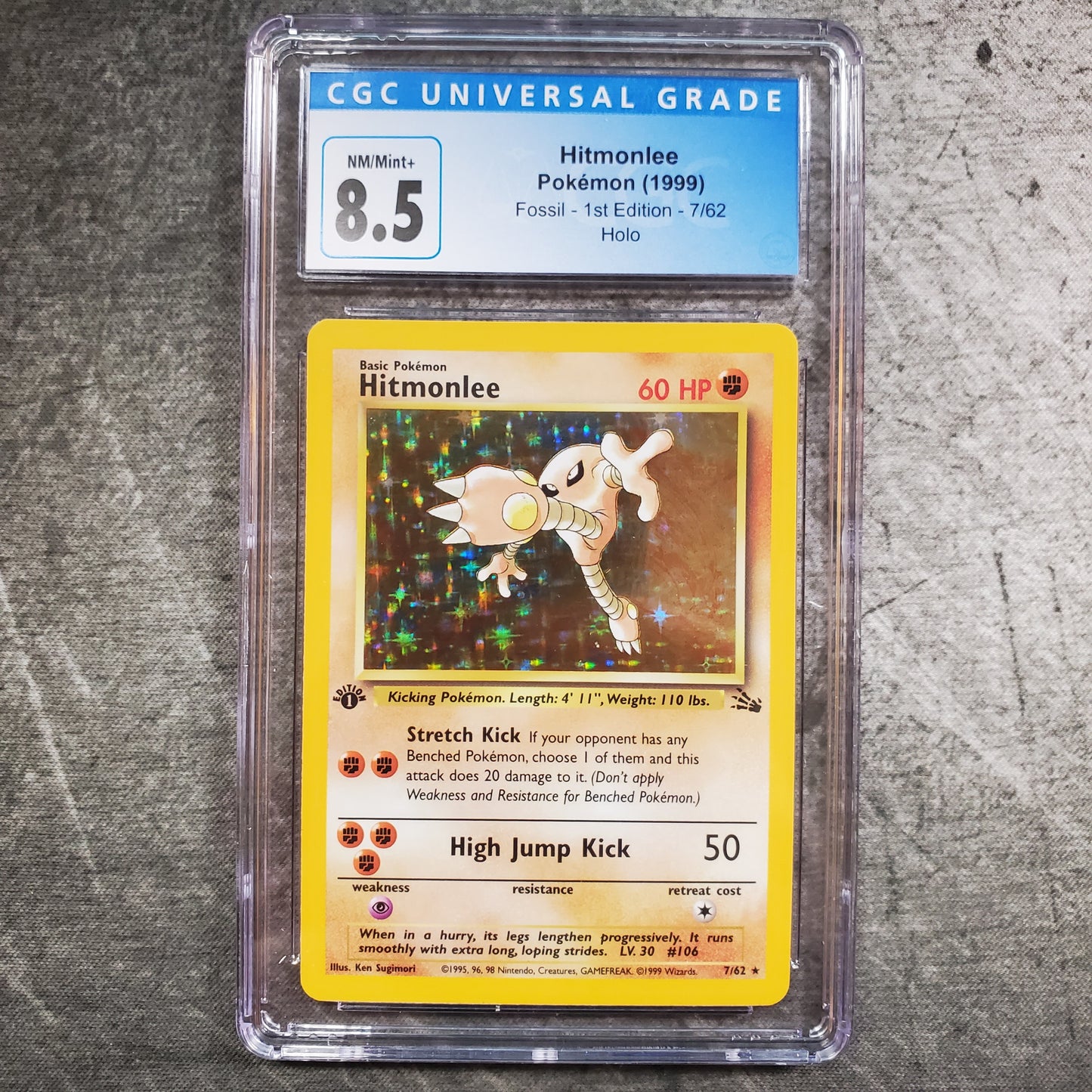 CGC 8.5 Hitmonlee 7/62 Holo Pokémon Fossil 1st Edition
